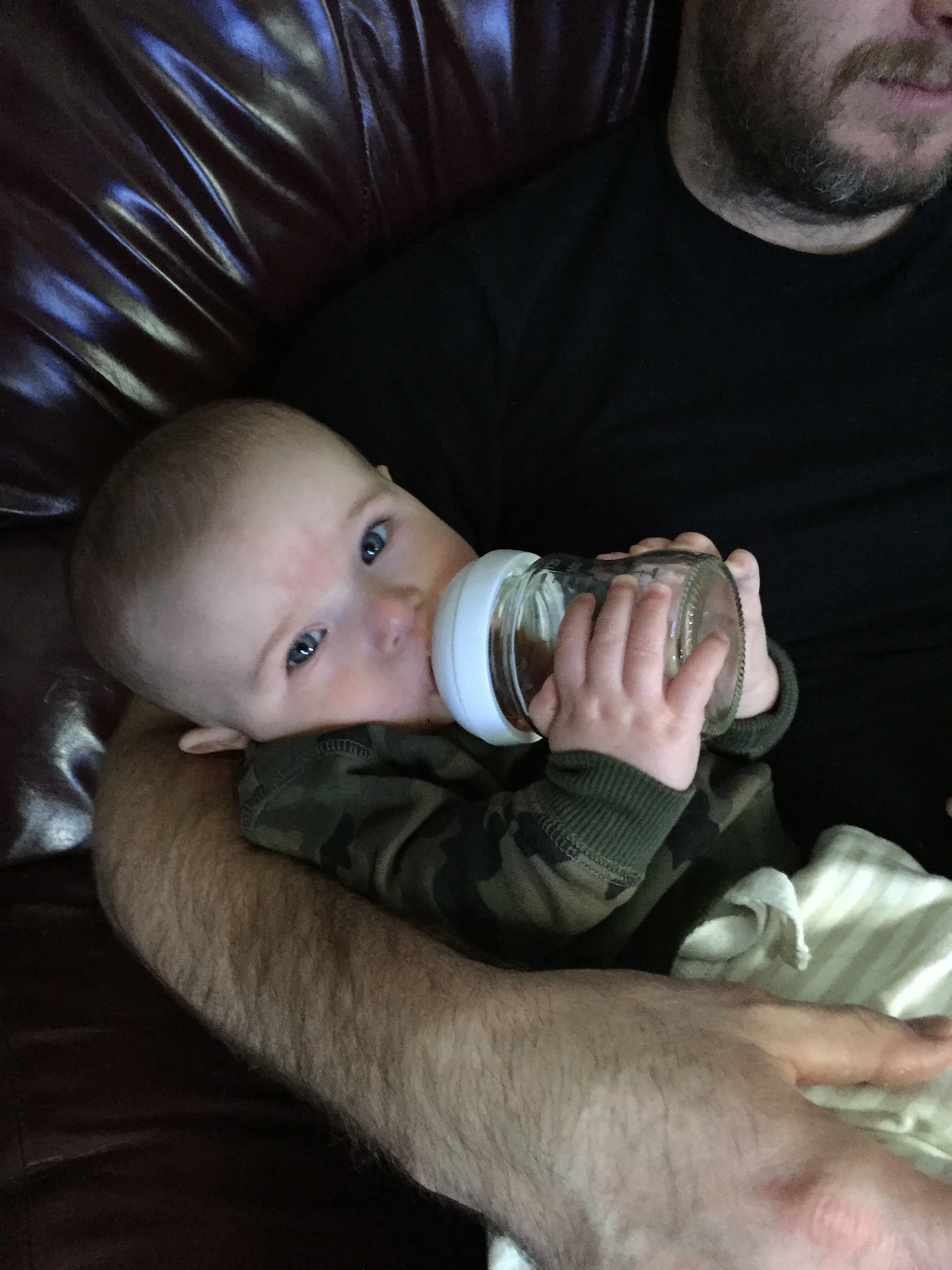  drinking his prune juice on his own (dad helped to start) 
