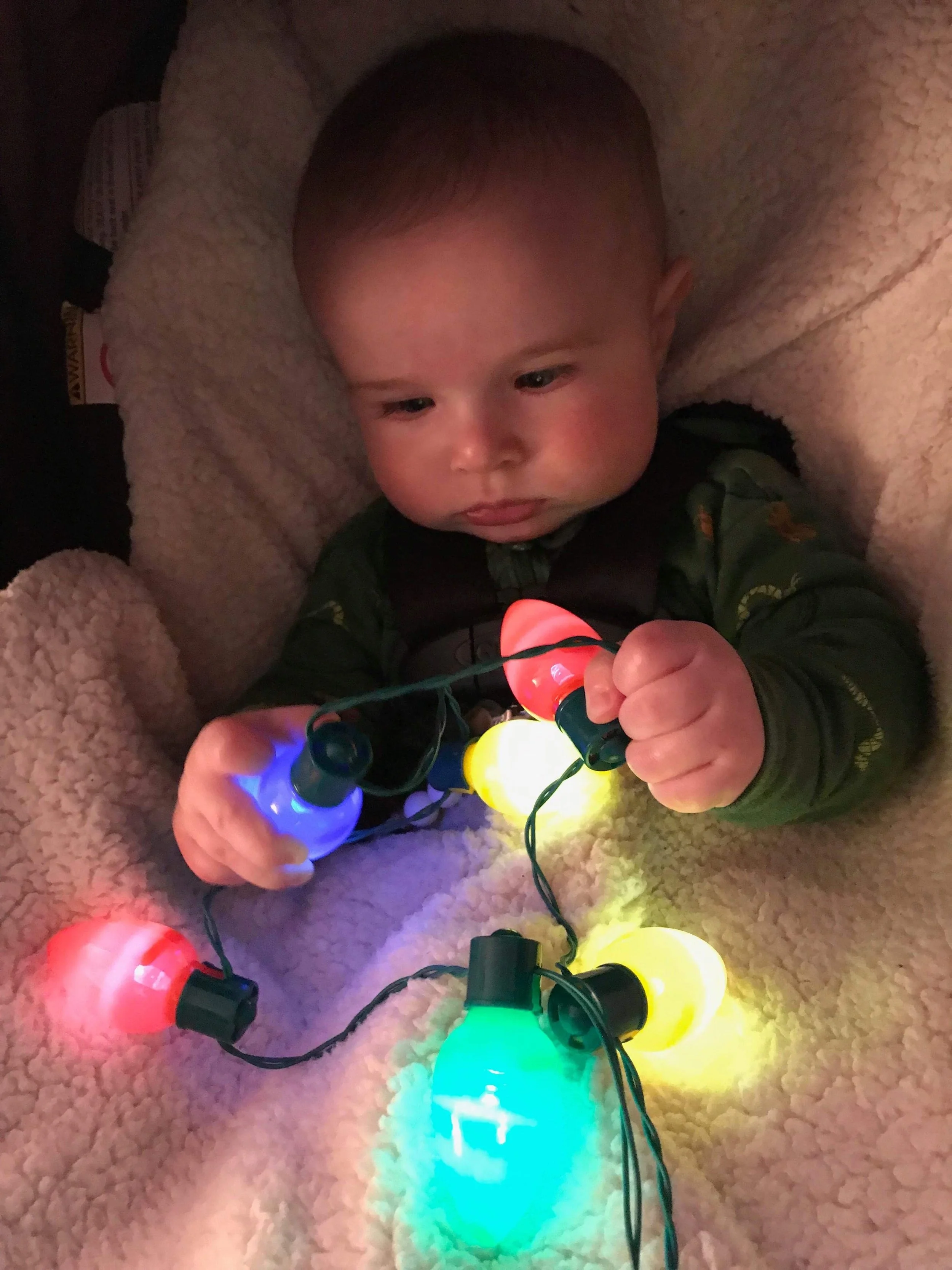  intrigued by the Christmas lights from Nana 