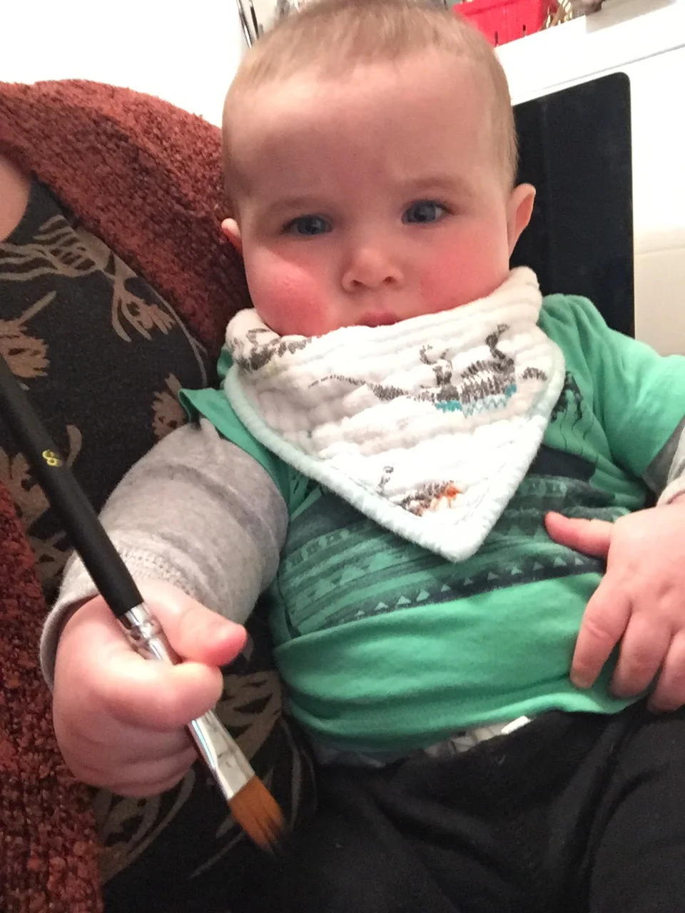  Learning to hold a paintbrush…but no paint yet 