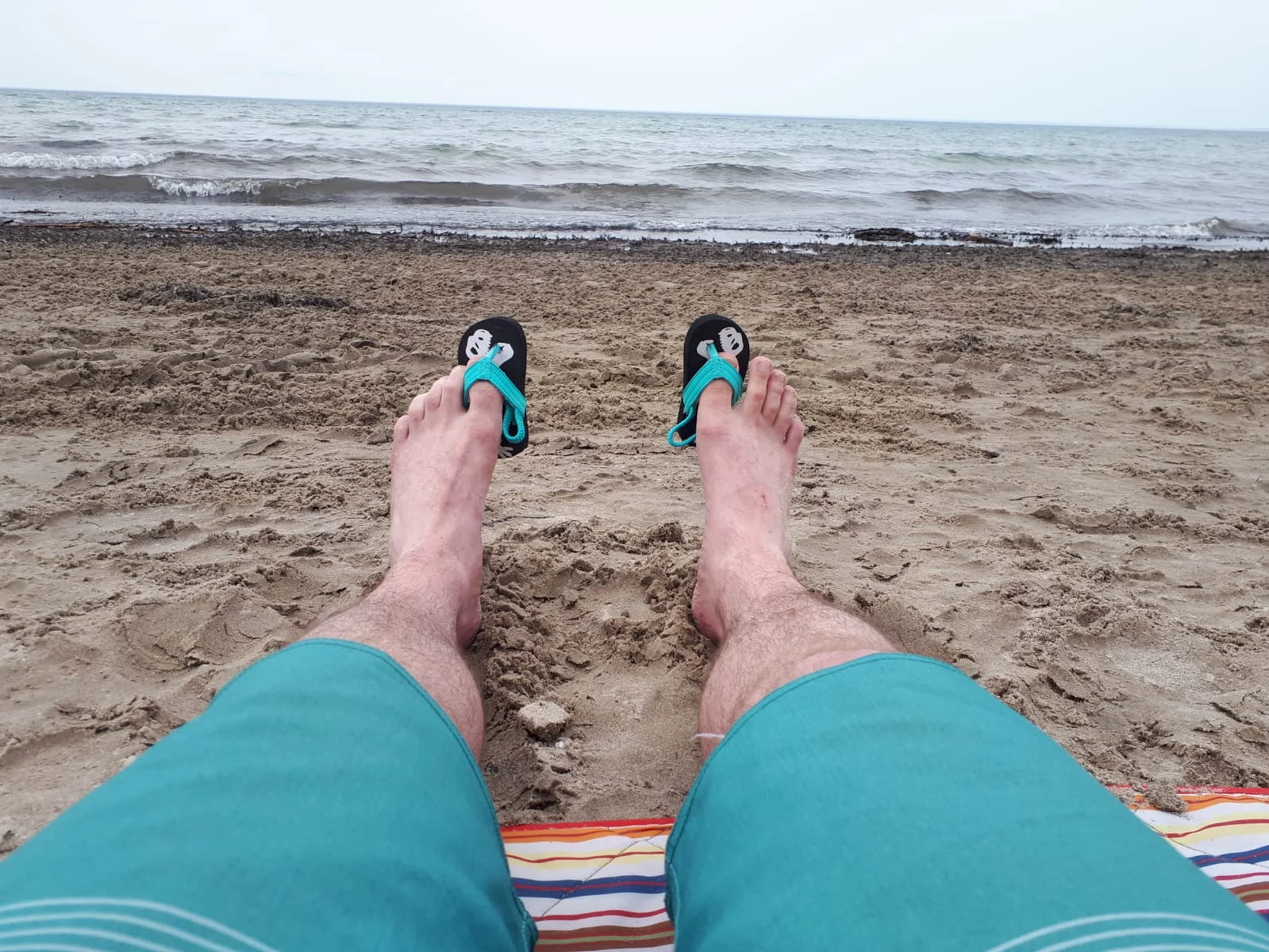  Dad took me to the beach and tried on my flip flops! 