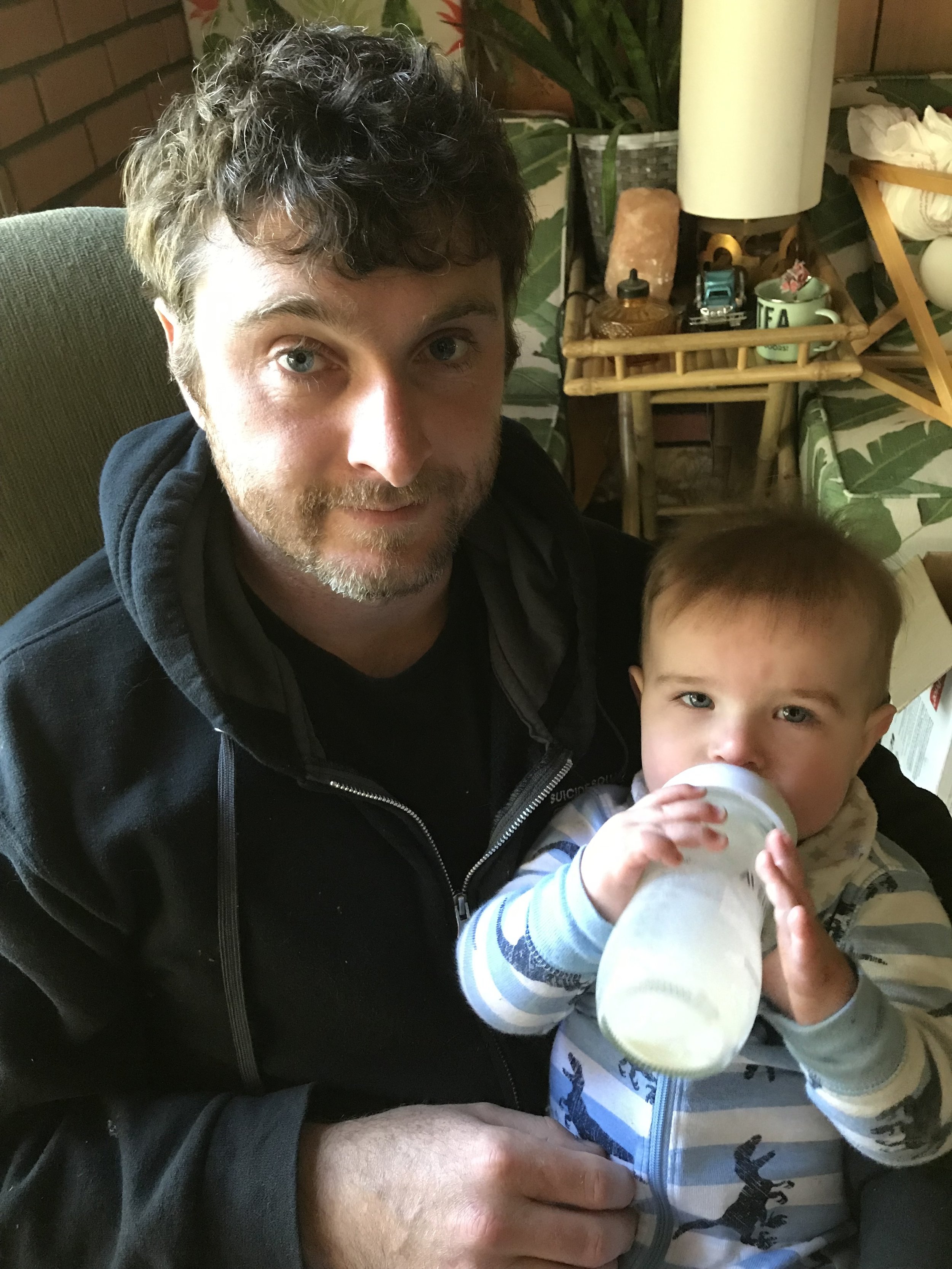  Holding his own bottle for bedtime feeding 