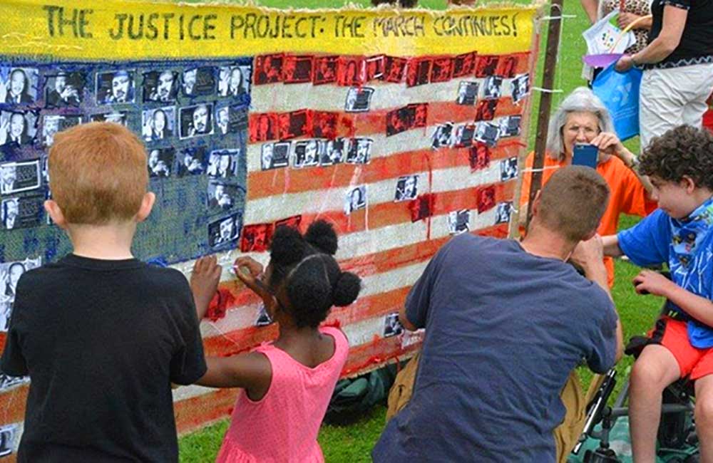 (2014 - Present) Nearly 1,000 gathered at the Winnetka Village Green for Justice Day , a celebration of past achievement for social justice and ending discrimination in housing, and a call to action for a concerted effort to continue the fight against racism and work toward the dream of a Welcoming Community in Chicago’s northern suburbs