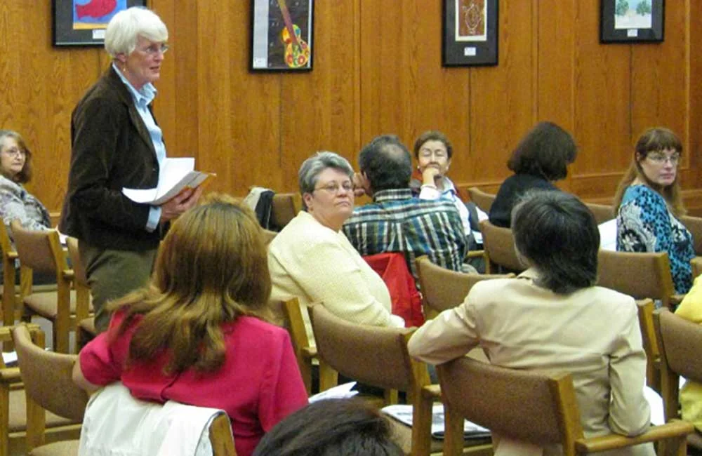 (2003) Nan Parson of Park Ridge updates other north suburban fair and affordable housing advocates at Open Communities’ Fair Housing Month event in 2009