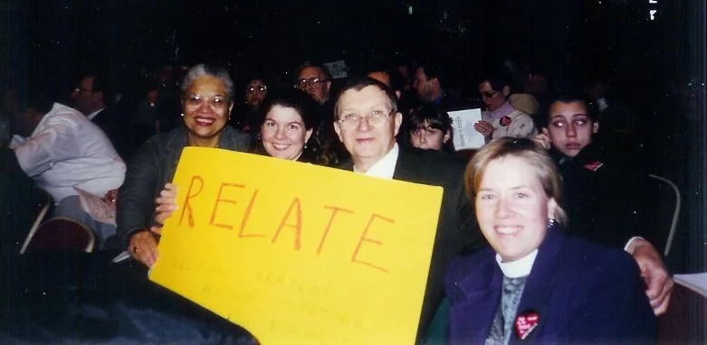 (1999 - 2002) Lorelei McClure (then of the Baha'is of Evanston and the National Center), Pastors Stephanie Perdew and Dave Owens (First Congregational Church, U.C.C., Wilmette), and Rev. Heather VanDeventer (St. Augustine's Episcopal Church, Wilmette) at an anti-hate rally at Niles West High School in 2000. RELATE was responsible for the hundreds of "No Room in My Heart forPrejudice" stickers worn by all that day, protesting the KKK.