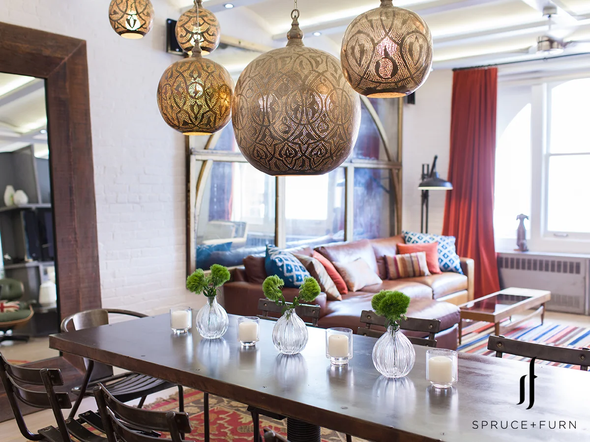 A group of ornate Moroccan chandeliers hanging above the table distinctly identifies the dining area. Photo credit: Steph Goralnick www.sgoralnick.com 