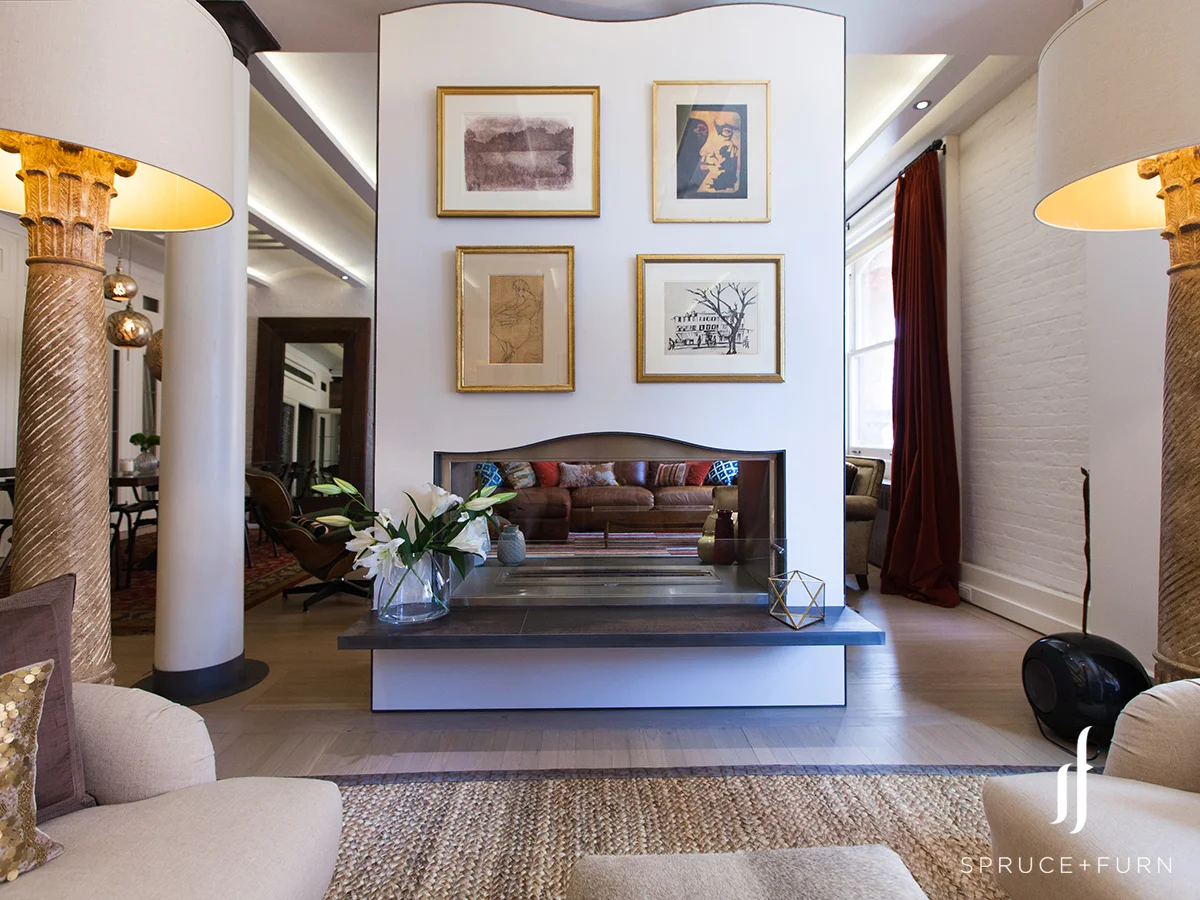 To split the more casual family room area from the more formal seating area, we used a narrow modern fireplace to divide the two zones. Photo credit: Steph Goralnick www.sgoralnick.com 