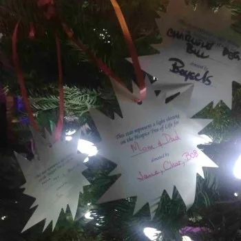 Santa Barbara residents Jennifer Thorsch and her husband Charles Kaska, placed stars on the Light Up A Life tree in honor of Thorsch’s mother, father and brother. (Charles Kaska photo)