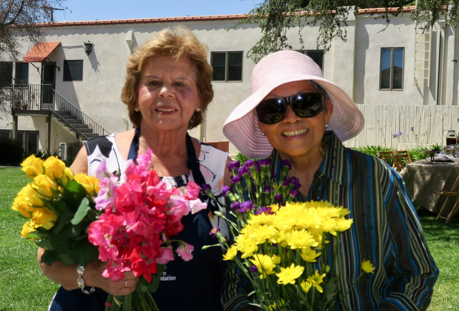 Volunteers Betty Dominguez and Carmen Romero, who have served for 19 years.