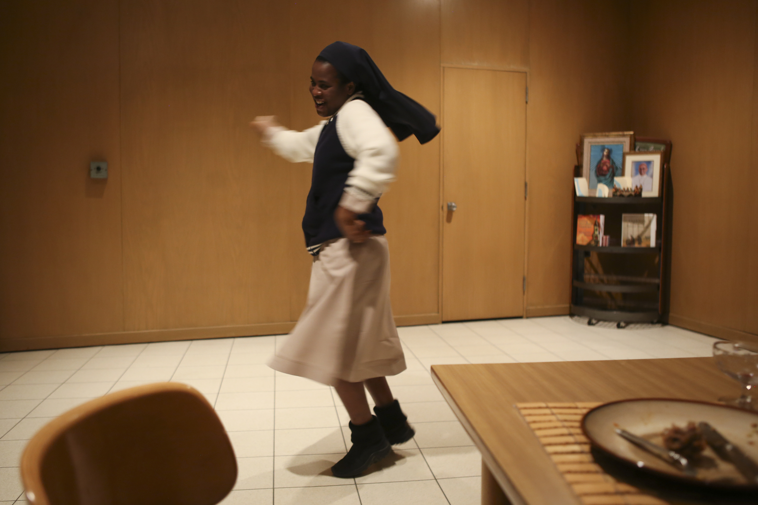  Sister Evelyn does a Bollywood dance after dinner at the convent house in Yonkers.    
