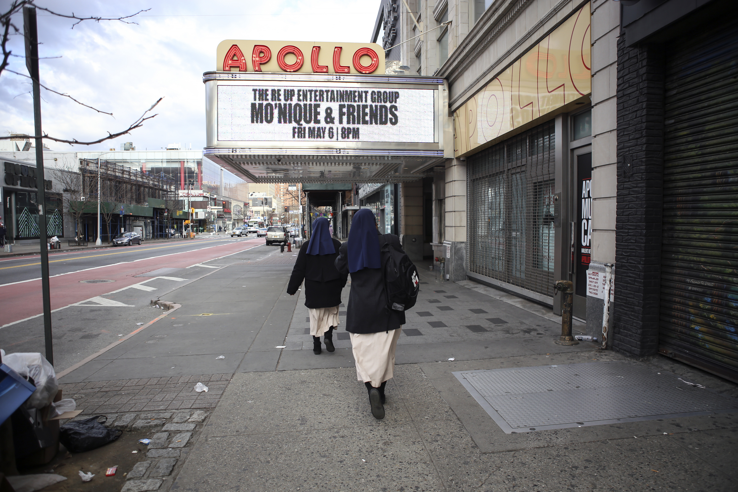  Sister Mary and Sister Anne Okori make their way from the mother house to the Church of St. Joseph of the Holy Family.    