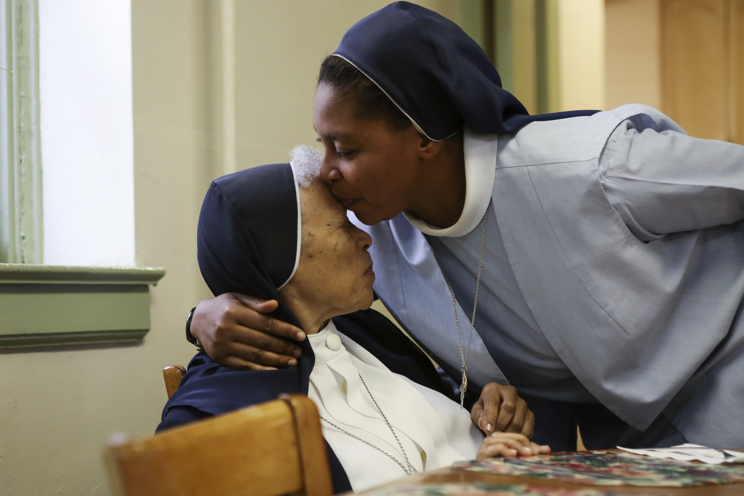 Sister Rosemary Onwuemene, right, and Sister Maria Goretti Mannix on Palm Sunday morning.