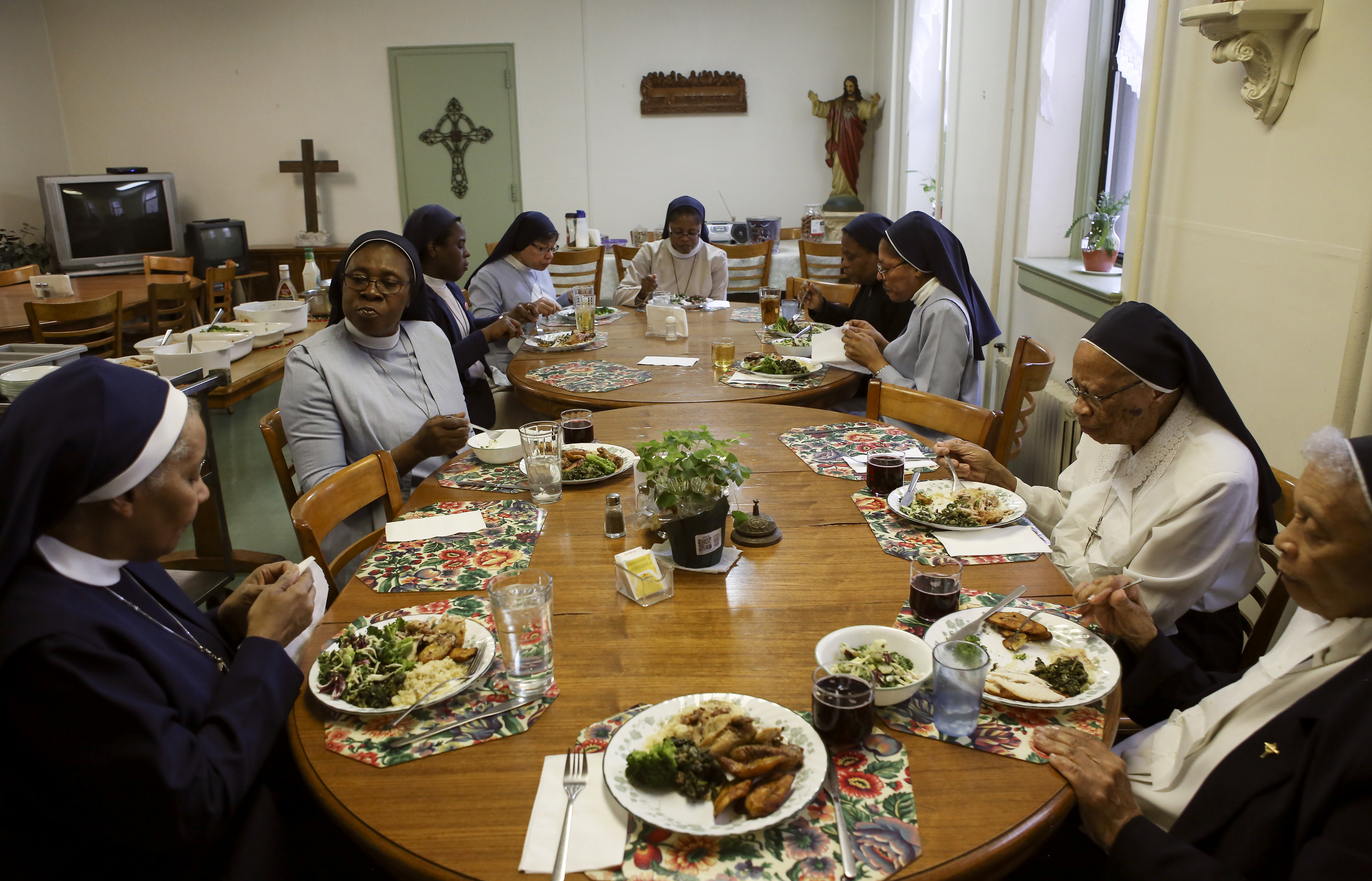  The sisters gather together for a post-mass meal on Palm Sunday. 