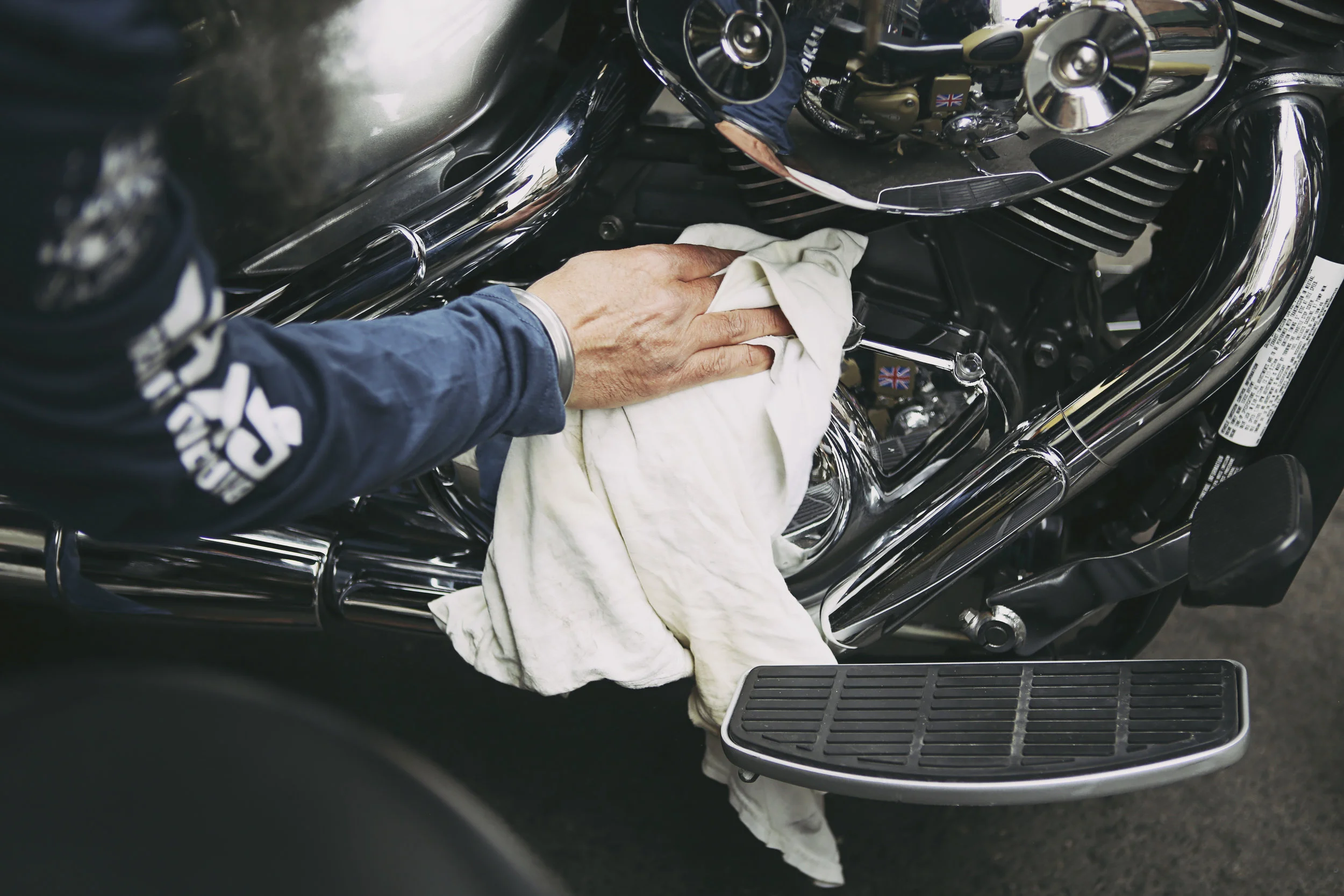 Harjot Singh Pannu polishes his motorcycle before the start of the Sikh Day Parade in Manhattan 