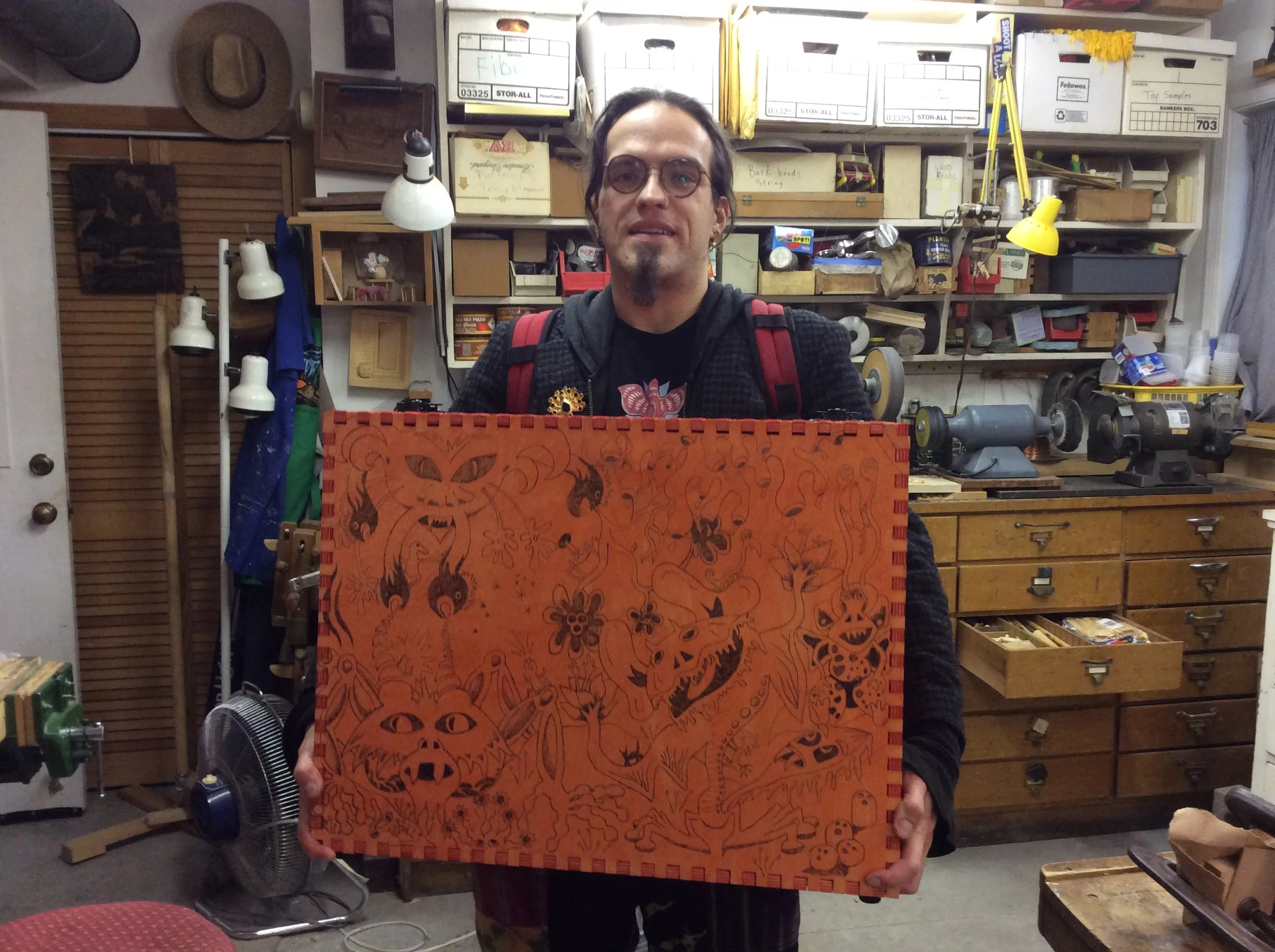 Devon made this case in a local makers' workshop but did a massive amount of wood-burning in the carving studio. He also made a beautiful ribbon maple handle. 