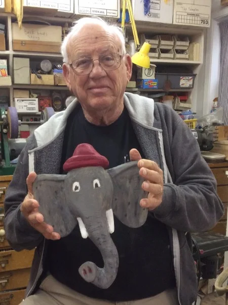 Art, part of our regular Thursday morning gang, finished this great piece This friendly elephant ives on the wall in his garage to keep his reusable grocery bags ready for the next grocery trip. This piece is basswood painted with acrylic paint. 