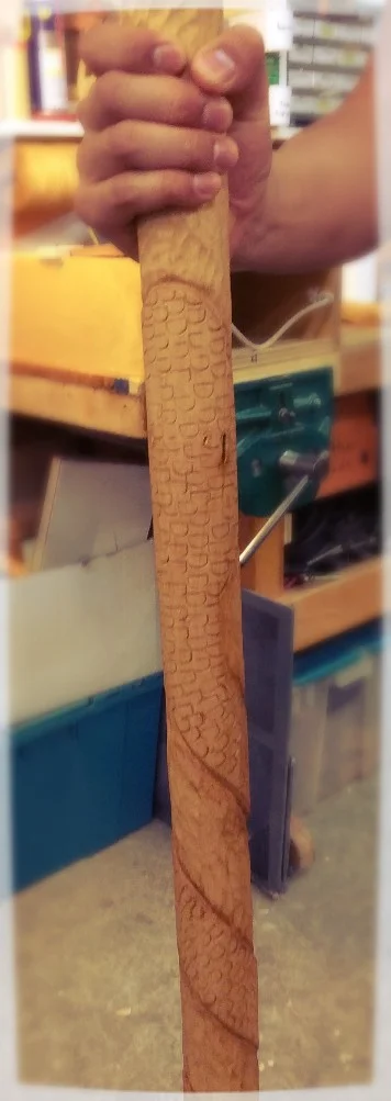 Daniel, after finishing his Grapes and Leaves, carved this snake wrapped walking stick. It is carved from Jelutong and the snake scales are punched with a large 1/2" metal letter "D" stamp. It makes a great scaly snake skin texture. 