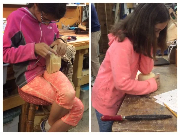 More of the younger generation of carvers, hard at work. Maisie is using the elbow clamp technique for sanding the outside of her Alaska Yellow cedar bowl. Bella is wrapped up with riffling her Jelutong Cat sculpture. 