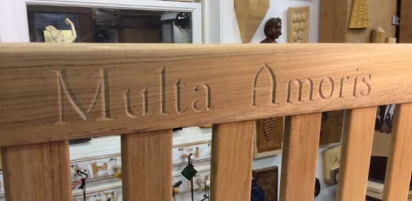 The second piece, also lettering, was an inscription carved on the back of a teak bench. Lots of things made this one hard. It was a birthday present with a time deadline, there was a shipping company hold up and numerous problems just getting the piece to me, then rush carving, and rush pick up but in the end it all came together. When the customer picked it up they told me the story of "Multa Amoris." The bench was for their mother's birthday. The saying was what their father signed on all of his letters. The father had recently died so it was somewhat of a memorial. I was so glad that it worked out well in the end. 