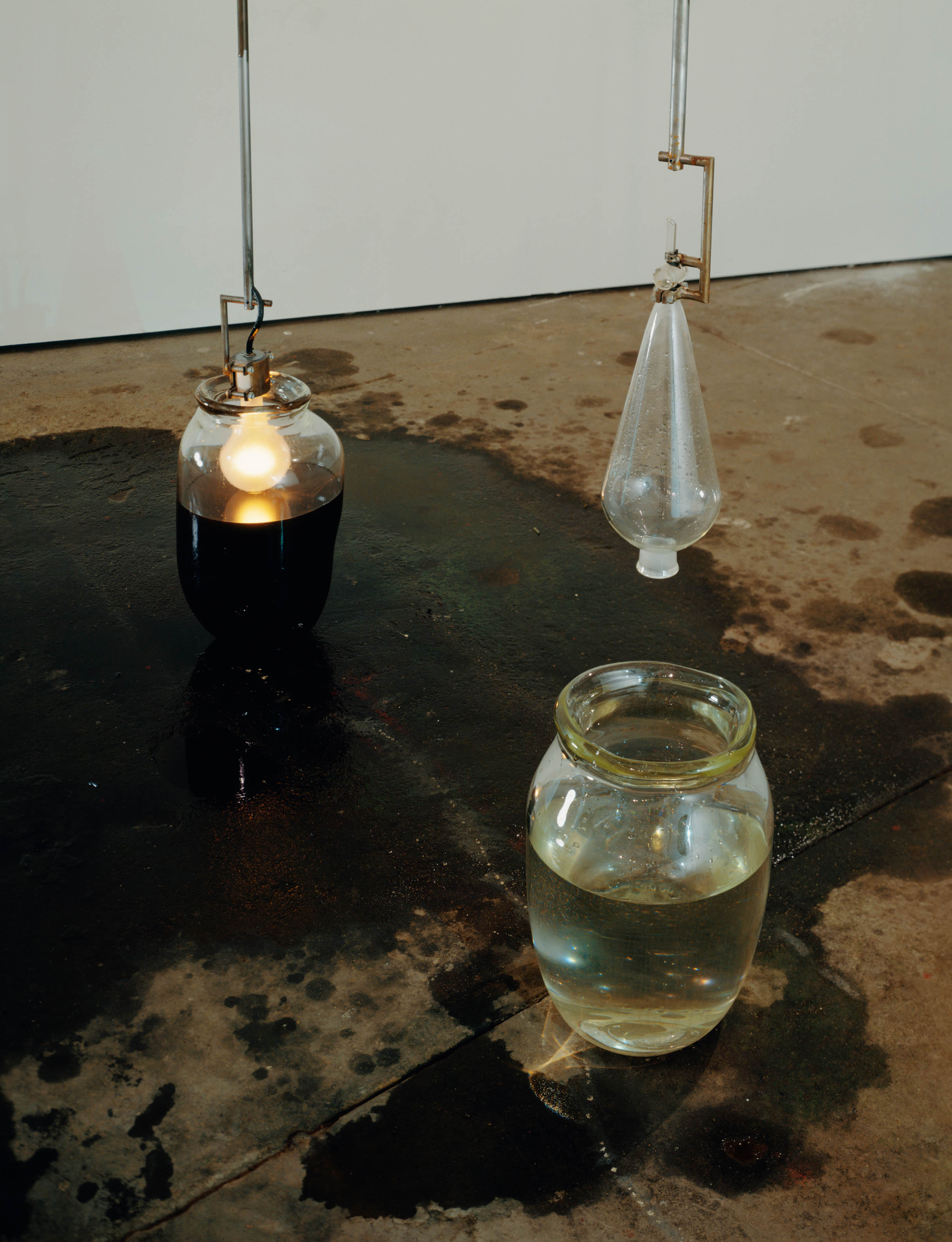  Lusts, 1992, Glass, water, lightbulb, steel, and motor oil, 100 x 20 inches 