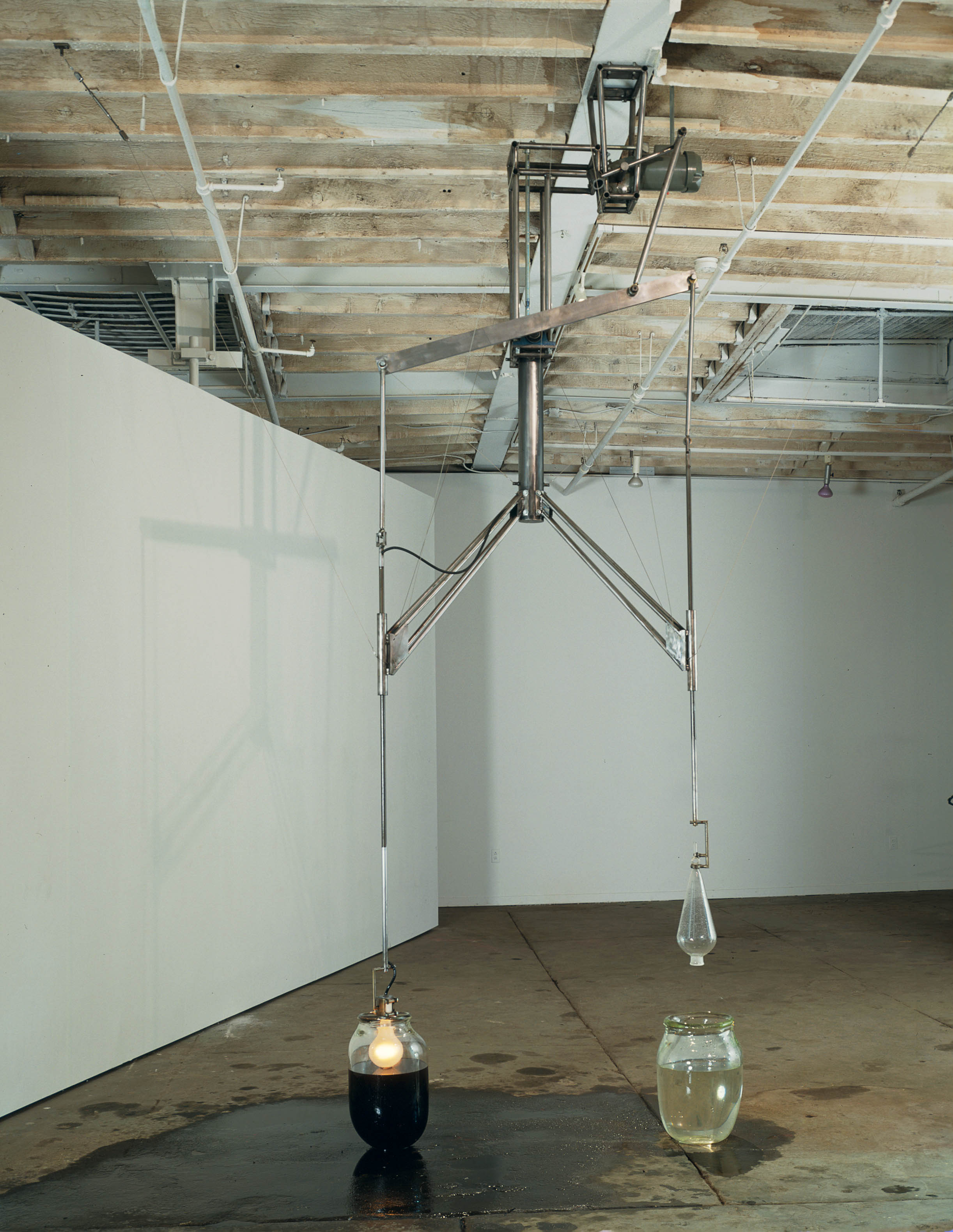  Lusts, 1992, Glass, water, lightbulb, steel, and motor oil, 100 x 20 inches 