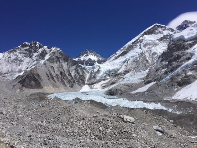 First view of base camp on the approach... the tiny colorful specs. Everest on far right with the lenticular cloud above.