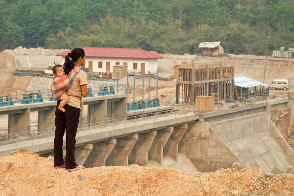  A woman looks over a dam being built by a Chinese company near Luang Nam Tha, Laos. 2004 