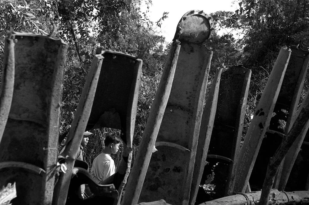  Fence made from American cluster bomb casings, Khammouane, Laos. 2006 