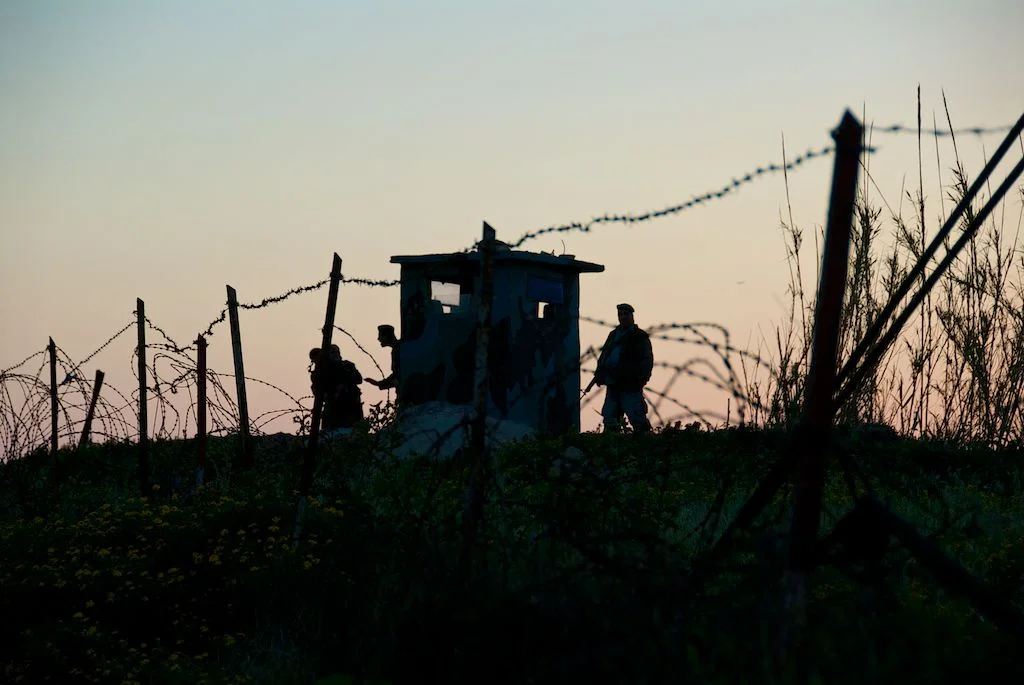  Lebanese soldiers turn civilians away from a checkpoint outside Beirut, 2007. 