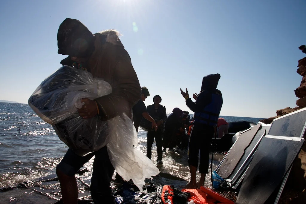  Migrants step ashore on Chios, Greece. 