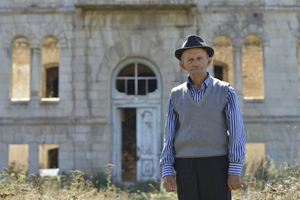 A former student in the ruins of his old school, destroyed in the fighting for Shushi. Karabakh.