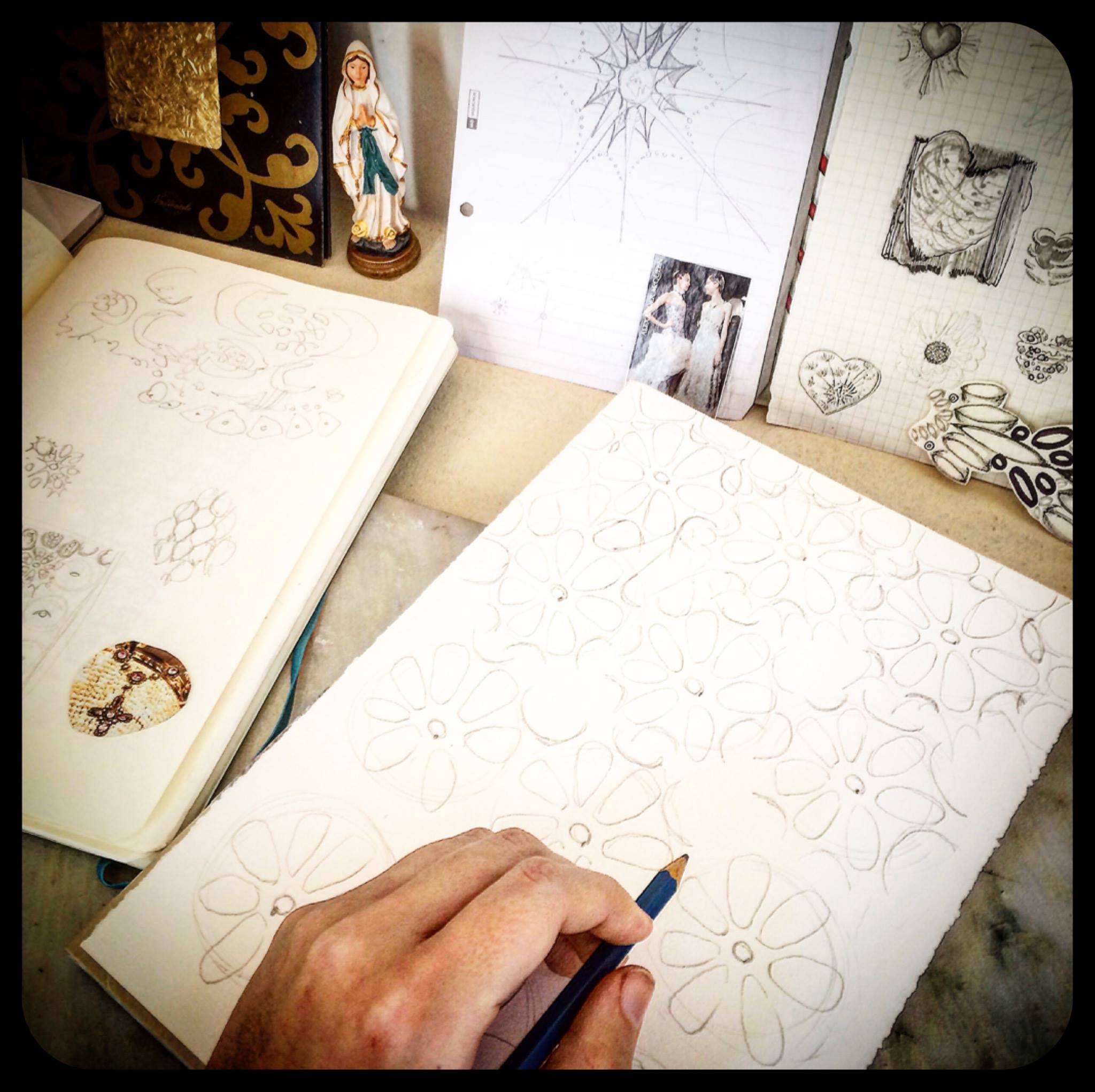 Day 2: Once I've got a basic idea for the design I want to create, it's time to start sketching. I still keep all the "dreamboard" elements nearby; throughout the whole process, staying close to what inspires me helps keep the design coherent.