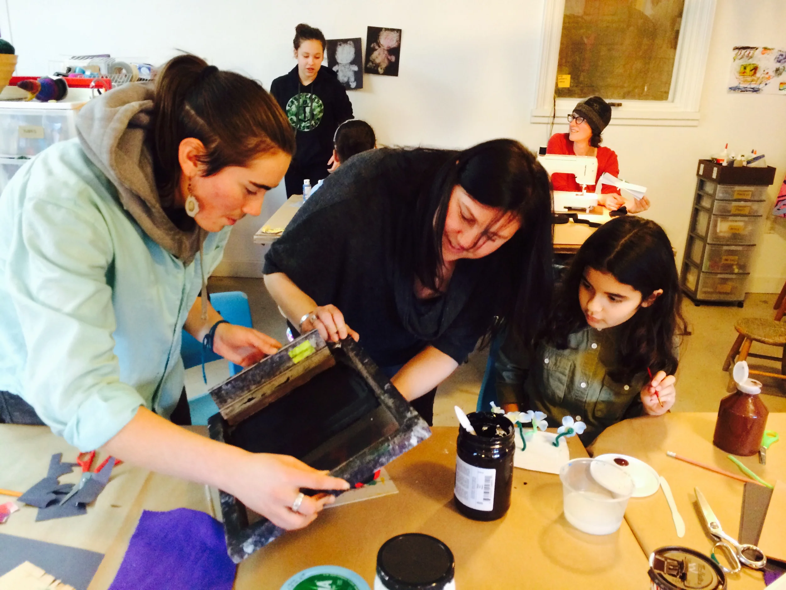 Jeighk helping with screen printing. Teachers are taking these simple ideas back to their classrooms!