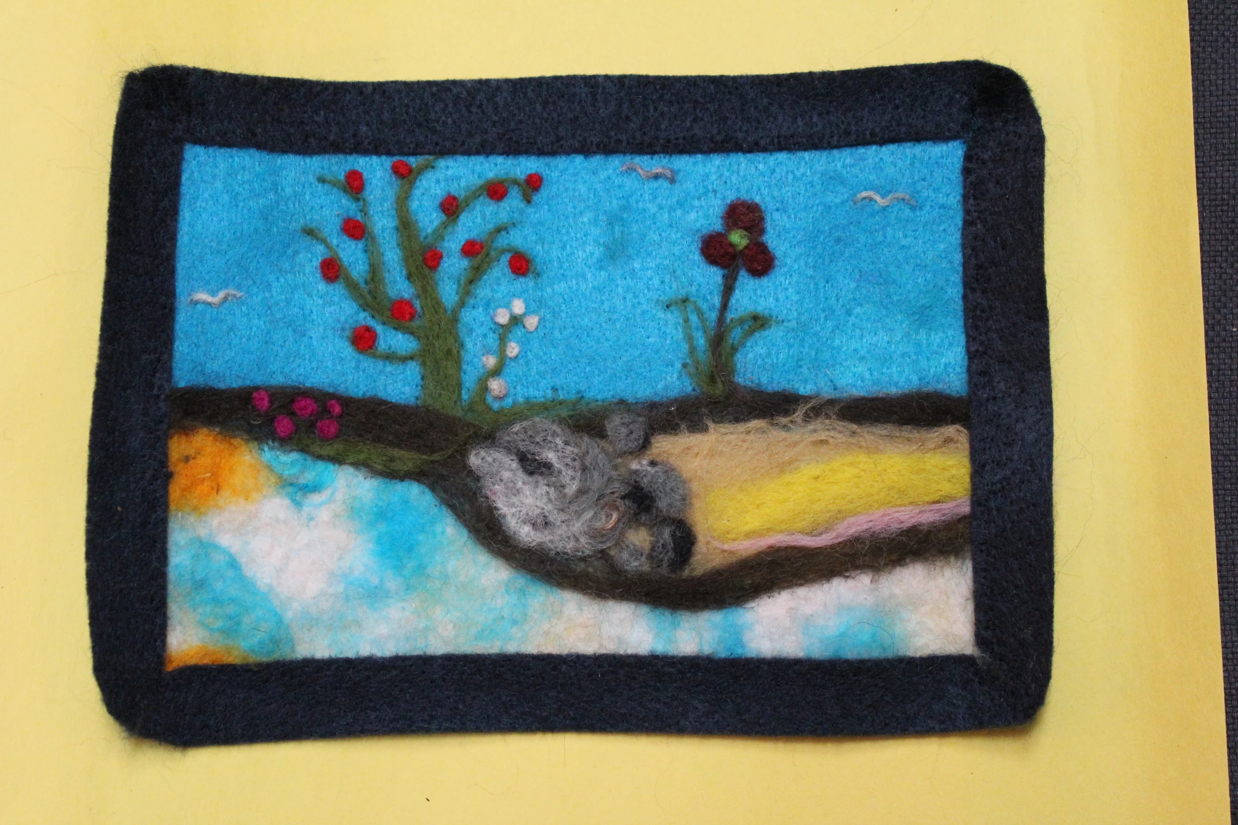 A first time needle felter's gorgeous landscape with frame. 