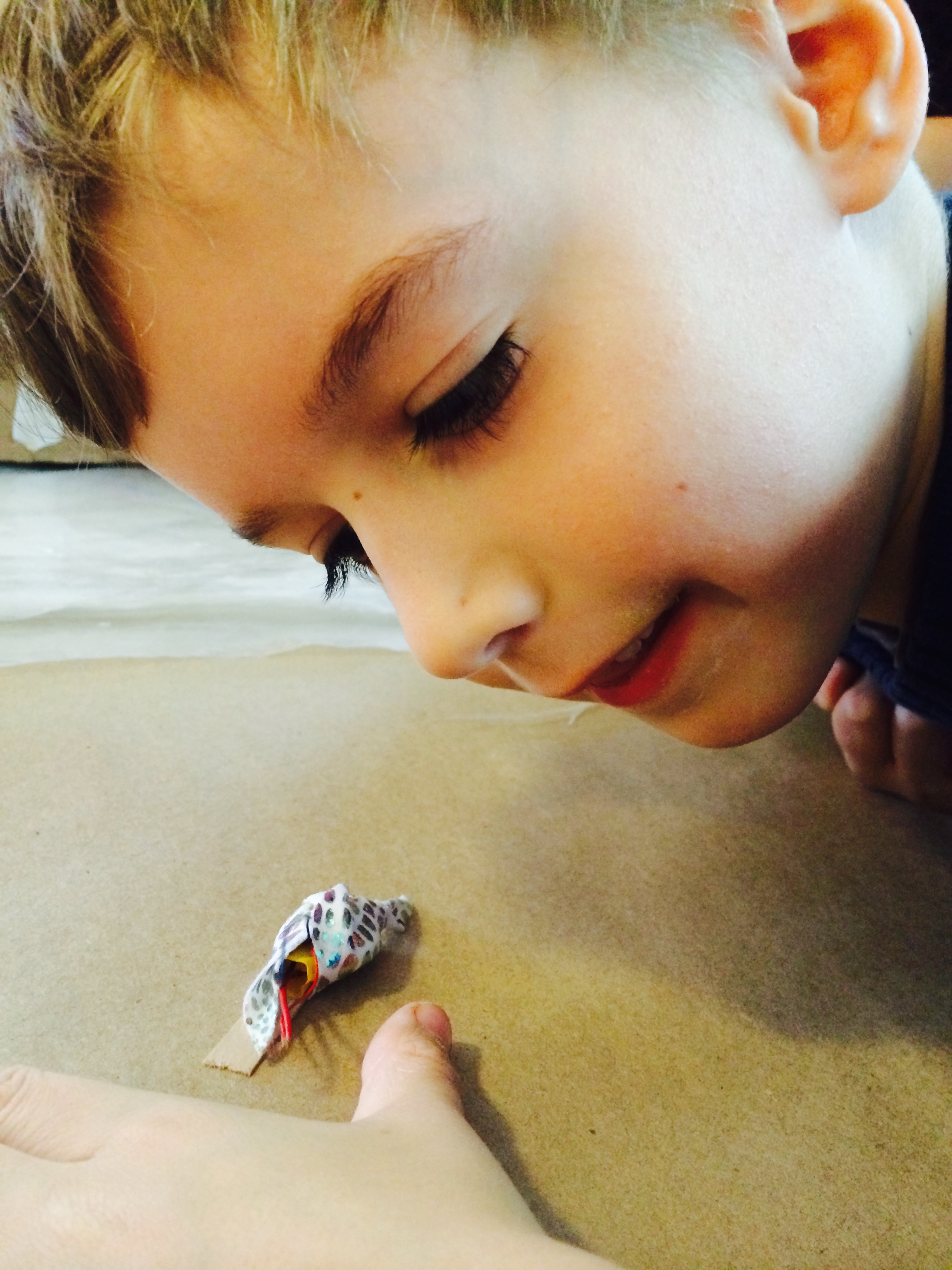 A Snailbot! Tiny little critter crawling all around the table!