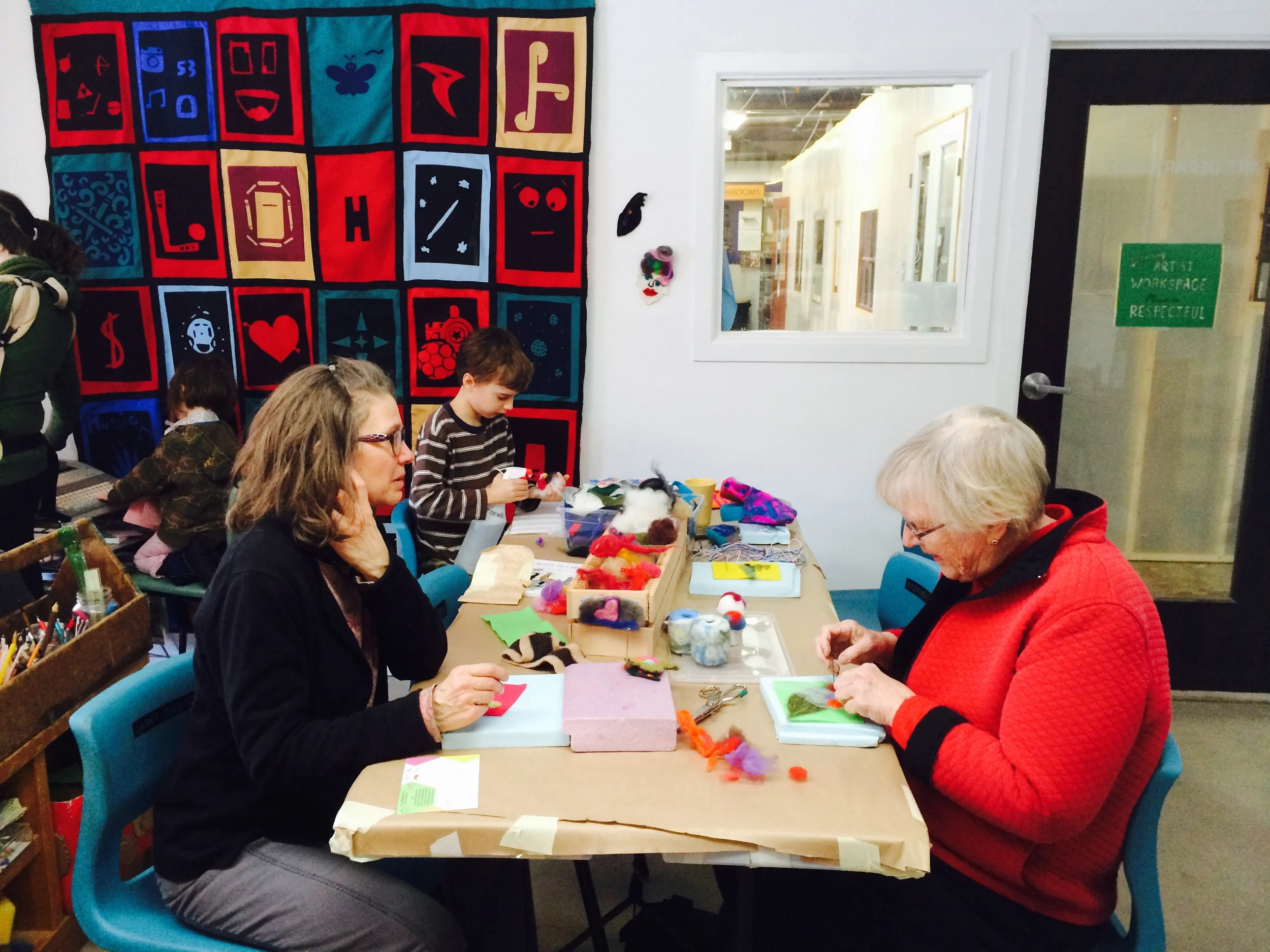 Needle felters and neighbours meeting for the first time. Sometimes the simple dialogue that surrounds an art technique allows people to feel at ease in a new space.