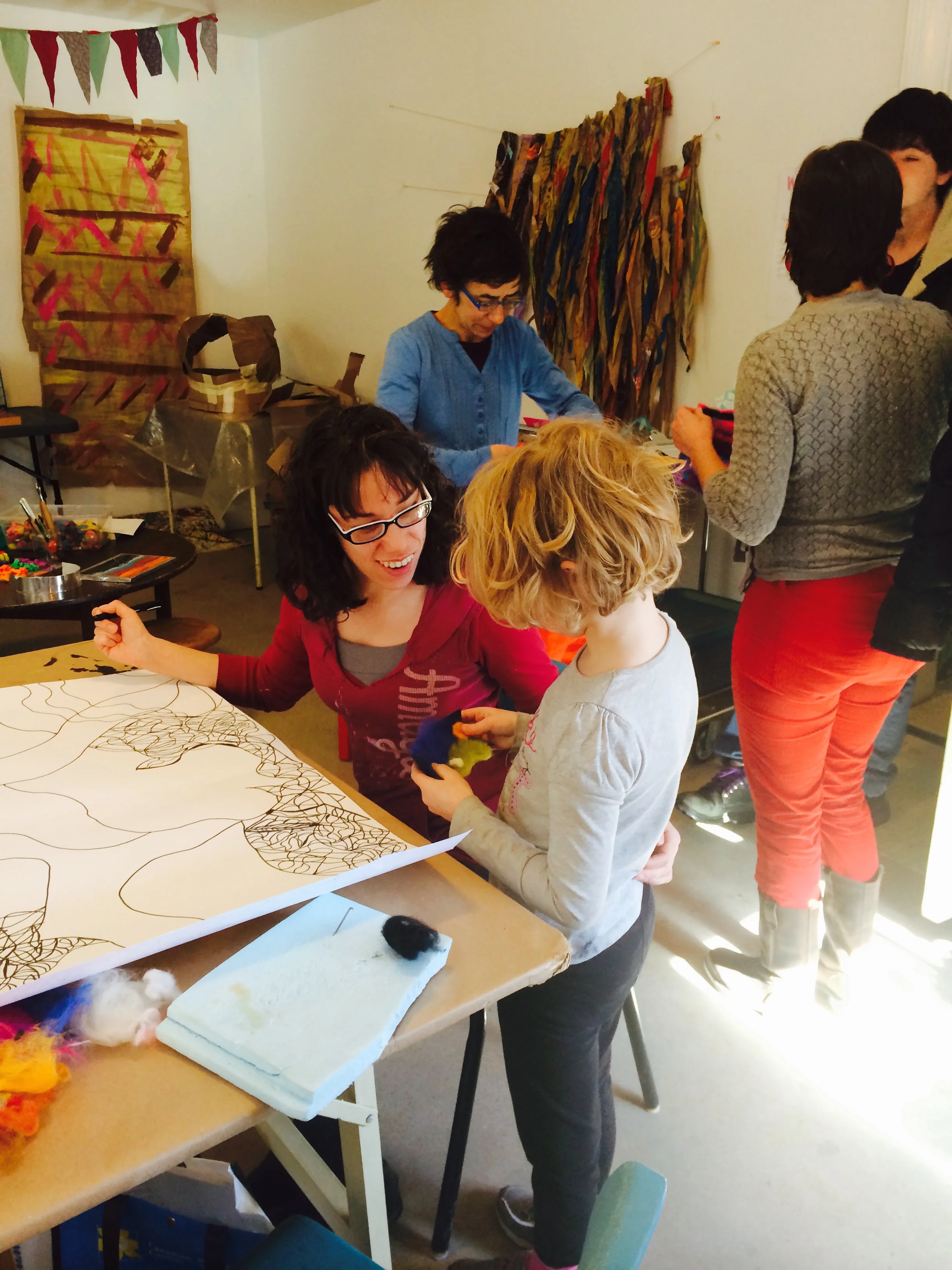 Sharing her creation with an experienced Team Possibles artist /Team City Art Hive facilitator.
