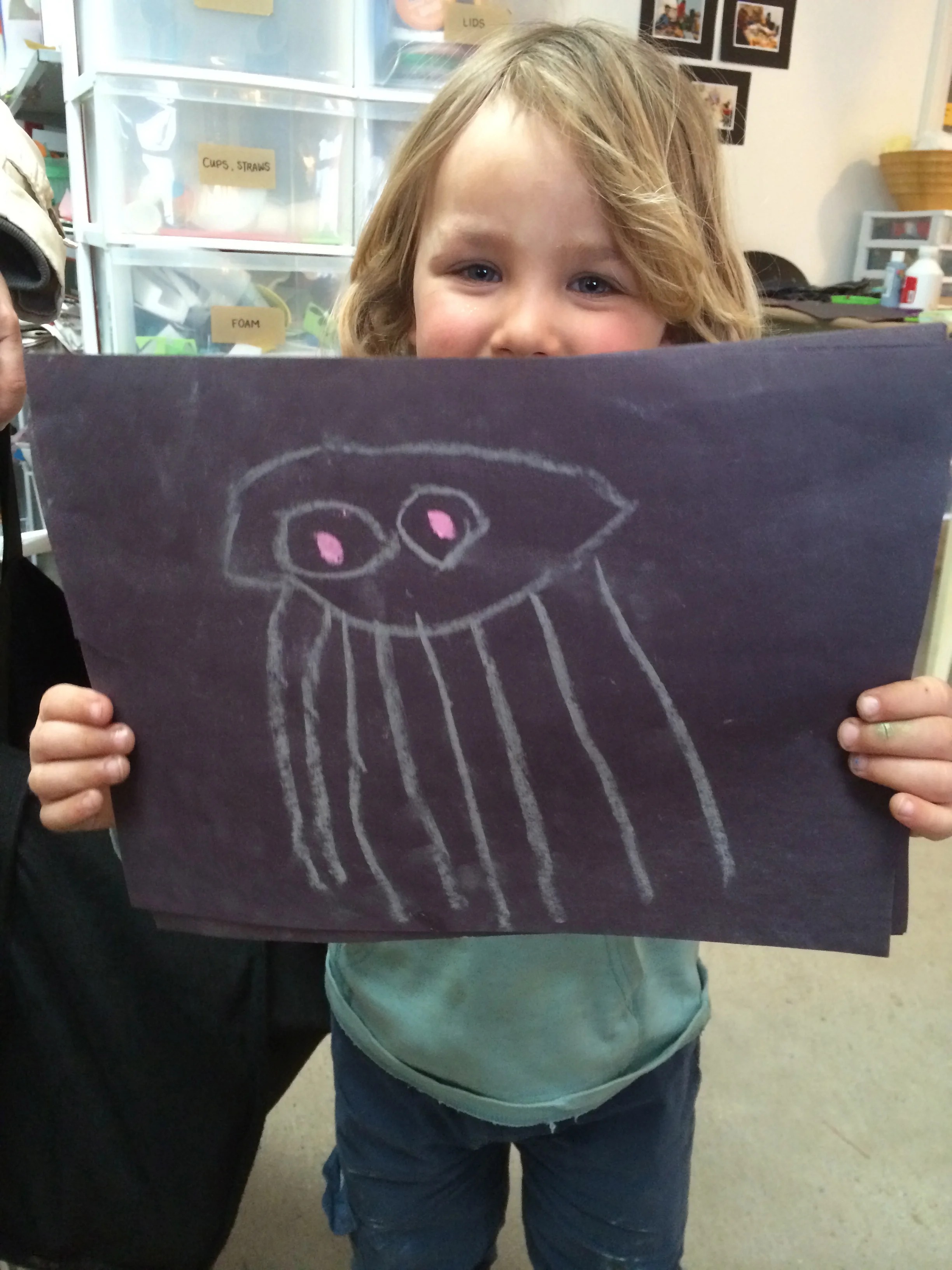 Jellyfish chalk drawing on black cardstock
