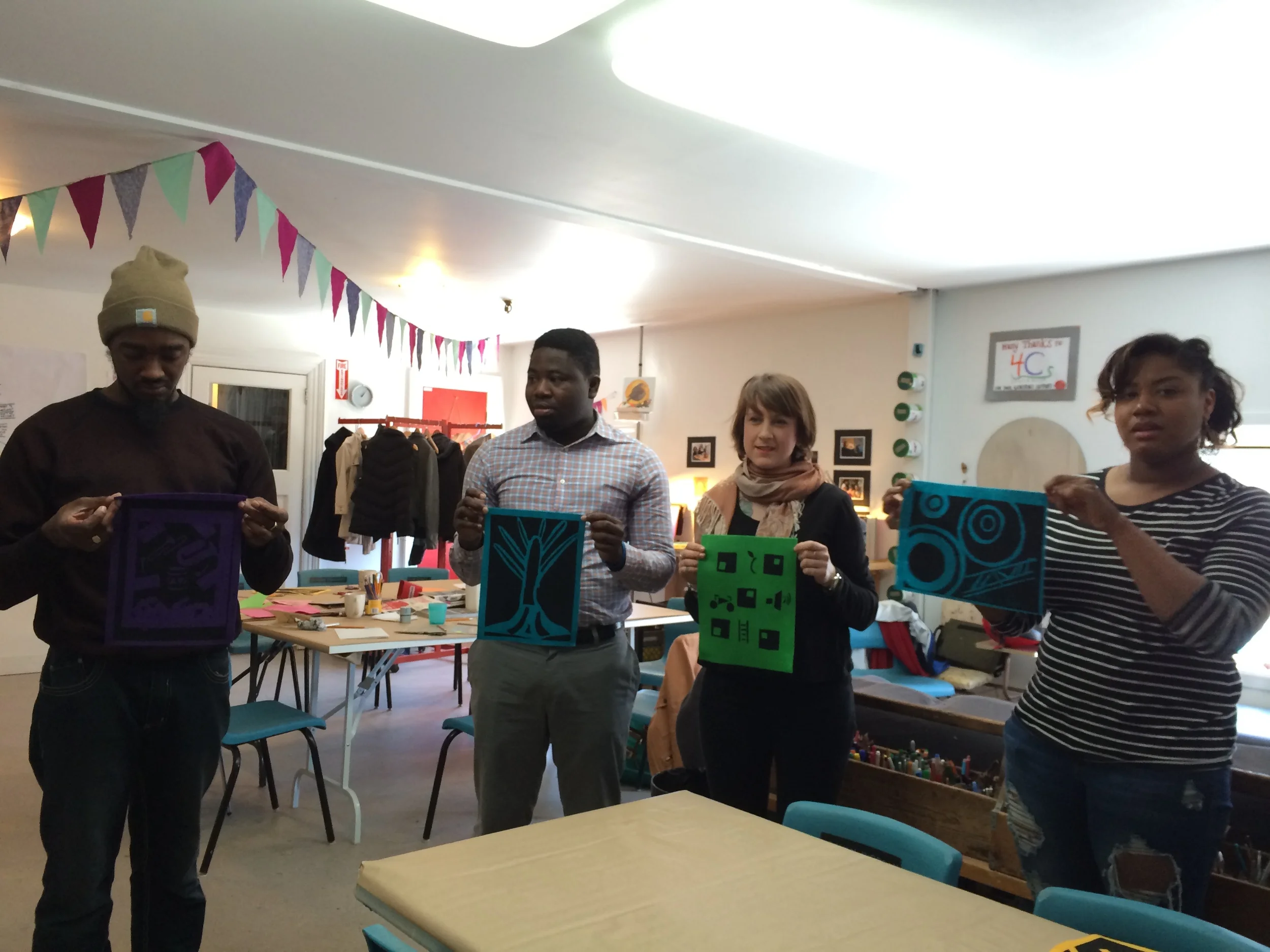 Northend Changemakers on site, trying out hand-cut stencil screen printing.