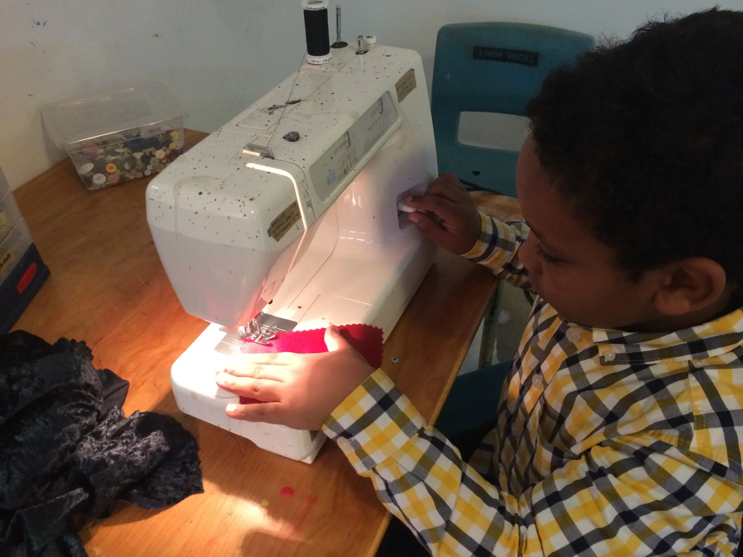 Introducing kids to the sewing machine is one of the highlights of working at the studio.