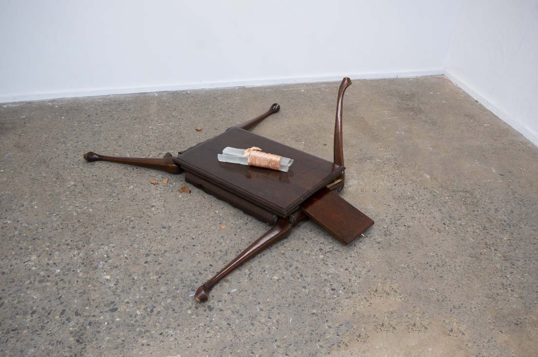   Spoils , 2022  Table, glass, ribbon 