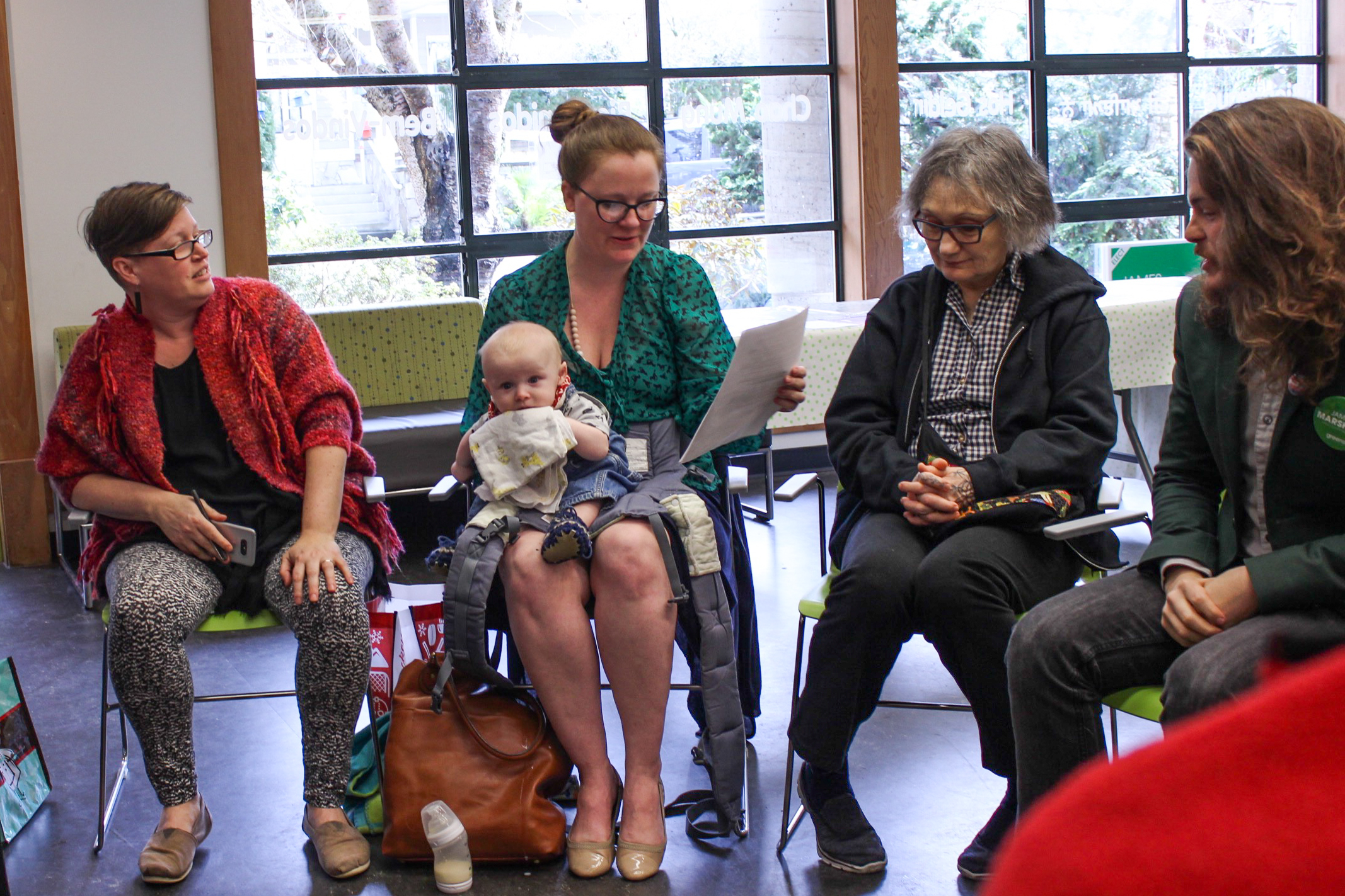  Green candidate James Marshall (right) hears from a West End Families in Action spokesperson. 