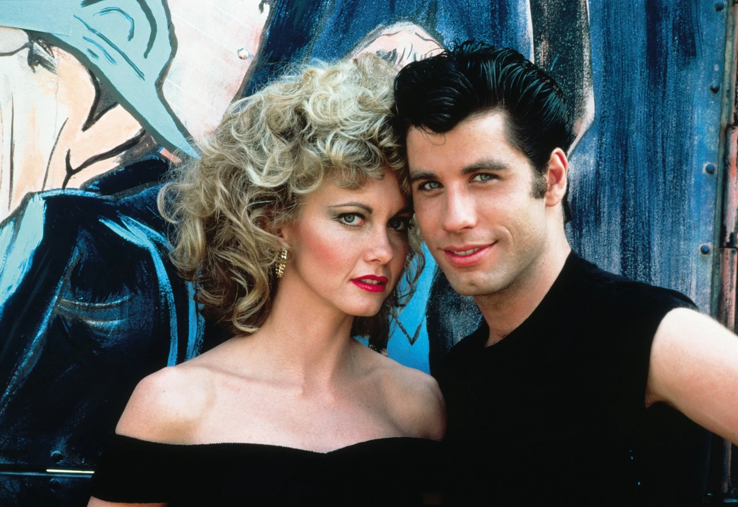 John Travolta and Olivia Newton-John star in "Grease", playing in Stanley Park August 14.