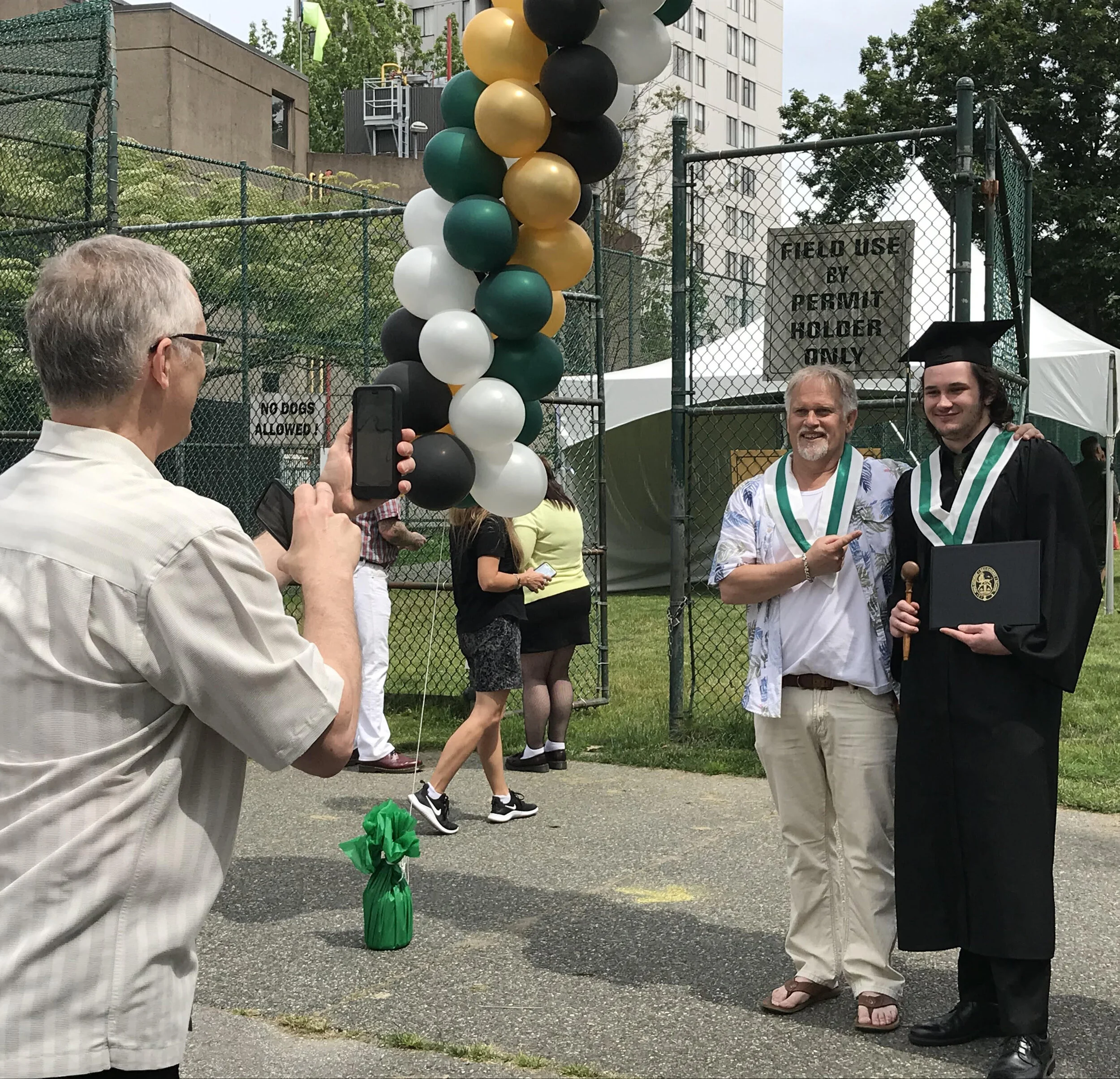 Alex and Jess, with his dad Byron taking a photo.