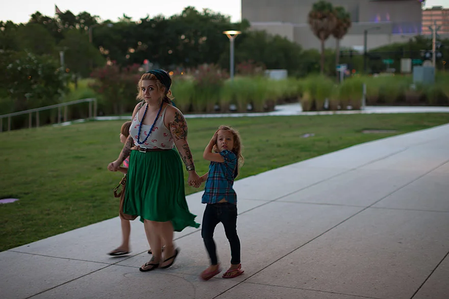 Mom walking with kids in downtown Tampa, Florida. © Jeremy Allen