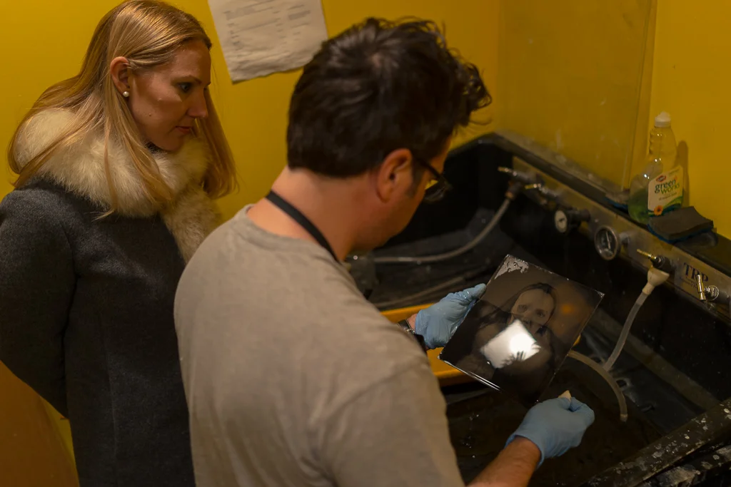 Joseph Gamble and Katie inspect the 8x10 tintype portrait (Sony RX1, iso 500, 1/40, f2).