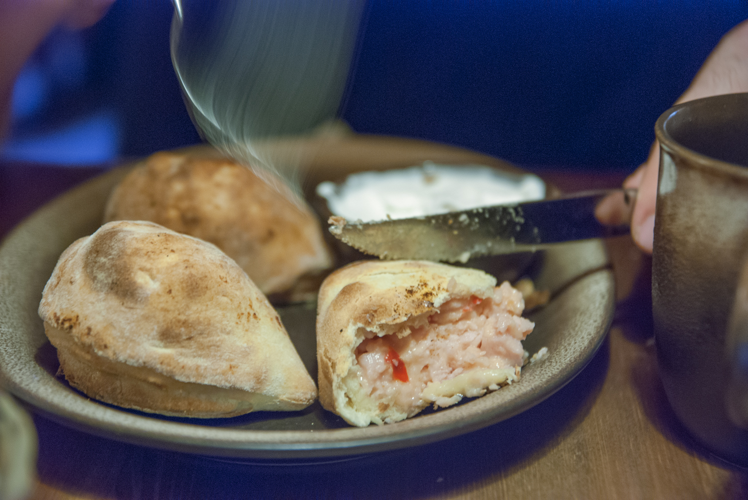 Baked pierogies with smoked ham, cheese and red peppers