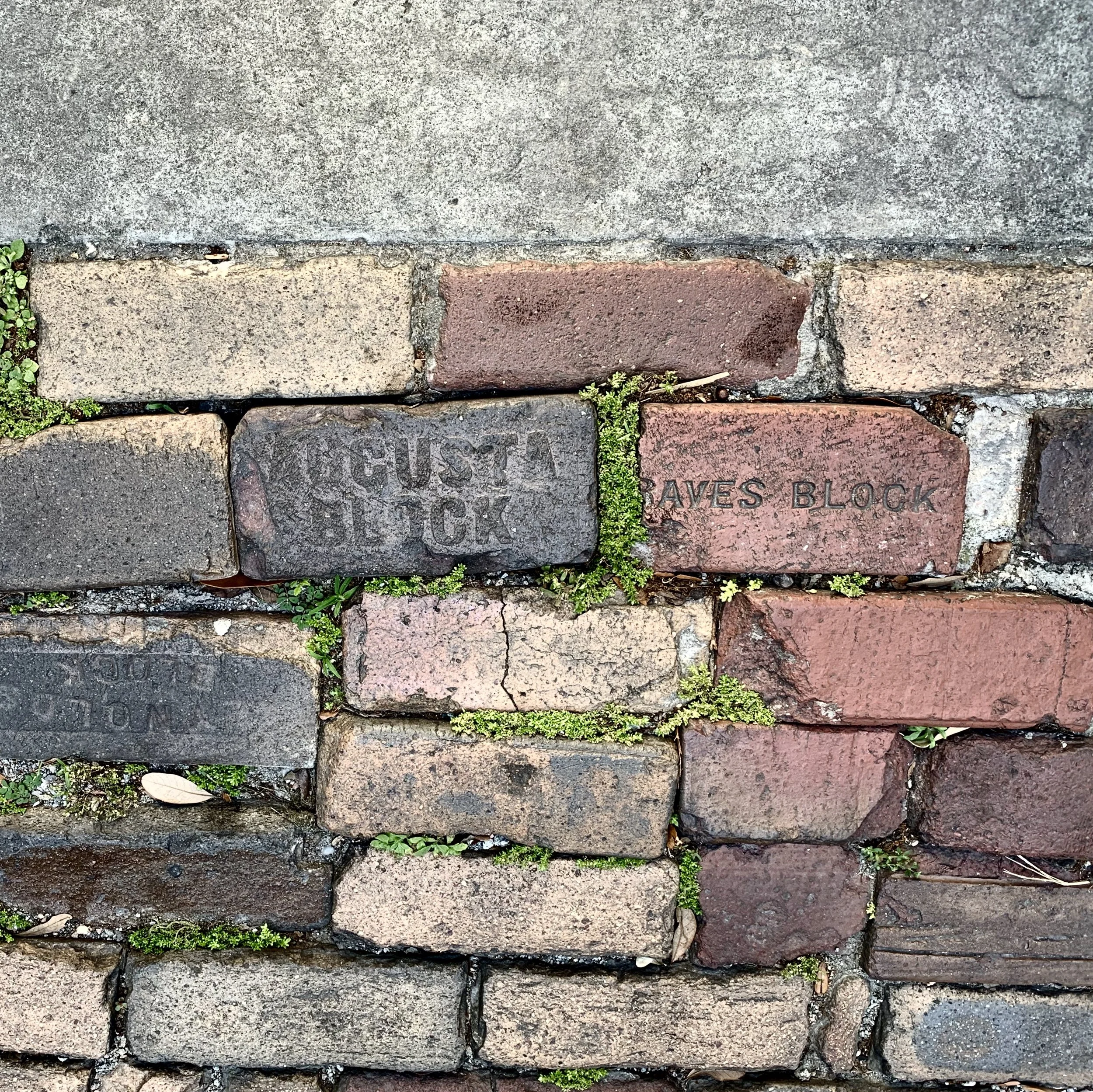  savannah, georgia  2019  Bricks formerly used as grave markers for enslaved Africans - now used as part of the street. 