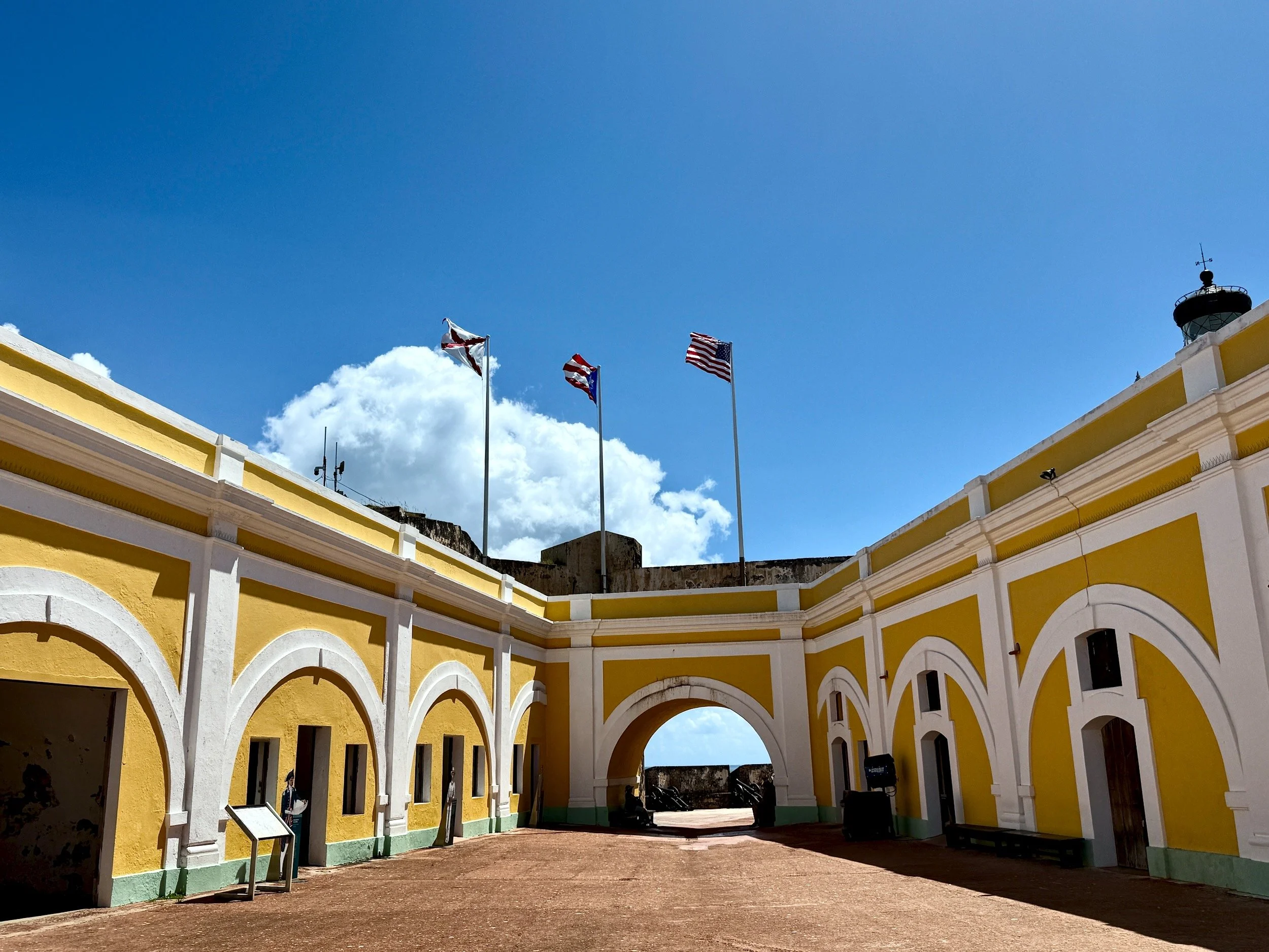 castillo san felipe del morro boriken | puerto rico 2025 The three flags represent from left to right: burgundy cross - spanish military flag commonwealth of puerto rico united states of america