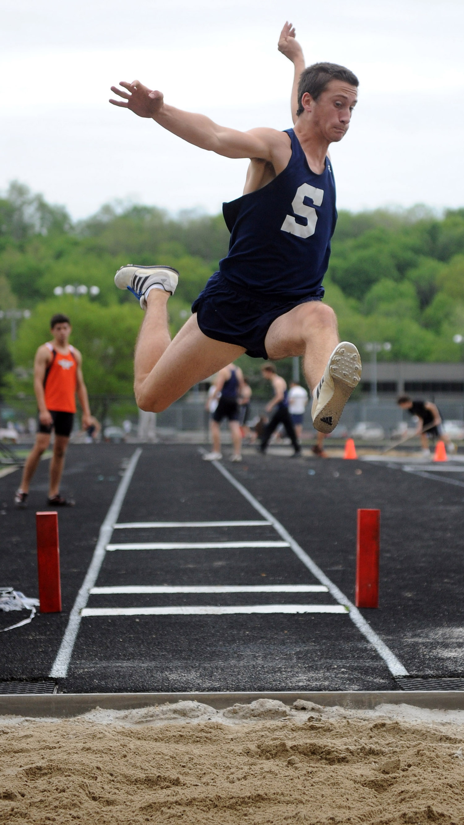  Dan Marriott competes in the long jump during a track meet at Wilton High School on May 19, 2011. 