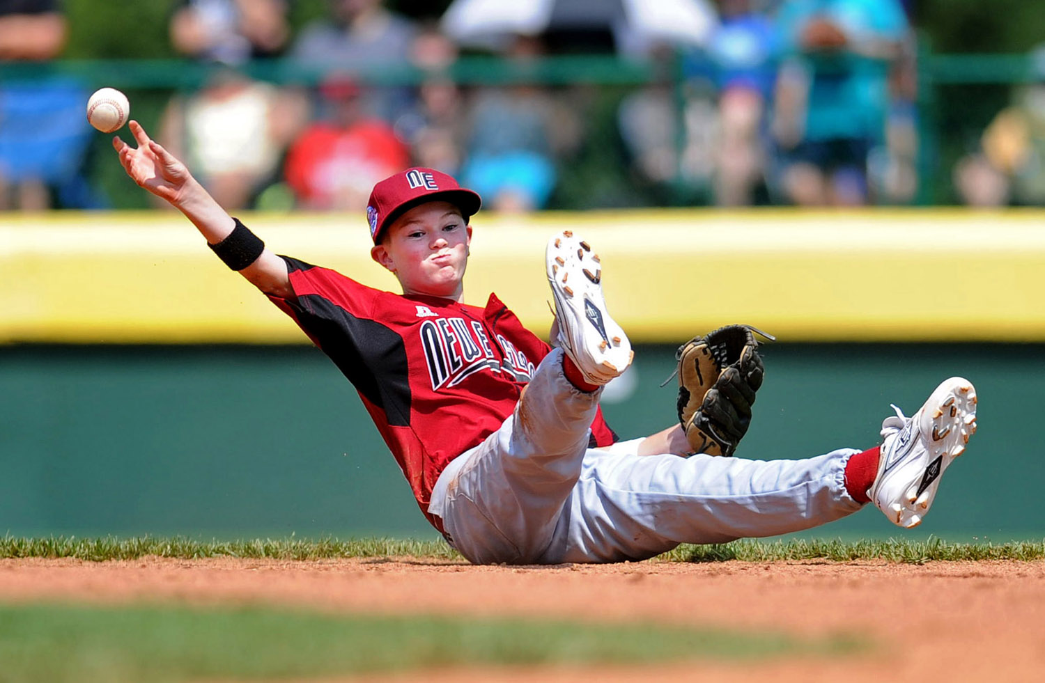  Billy McGrath throws to first after diving for a ball during Fairfield American's first game of the Little League World Series in Williamsport, Penn., on Friday, August 20, 2010. 